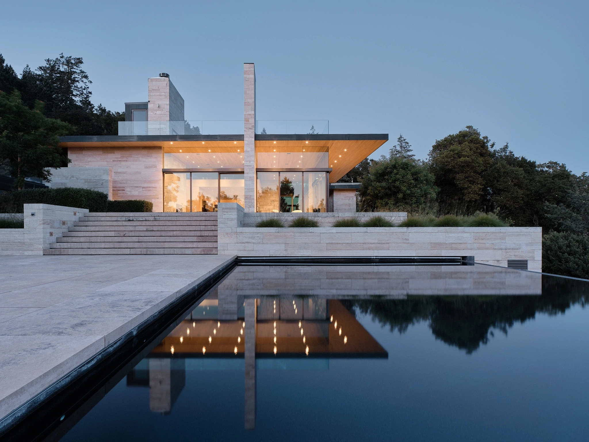 Contemporary residence reflected in an infinity pool